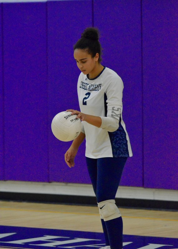 Seahawks junior Maya Hasting dribbles before her serve.